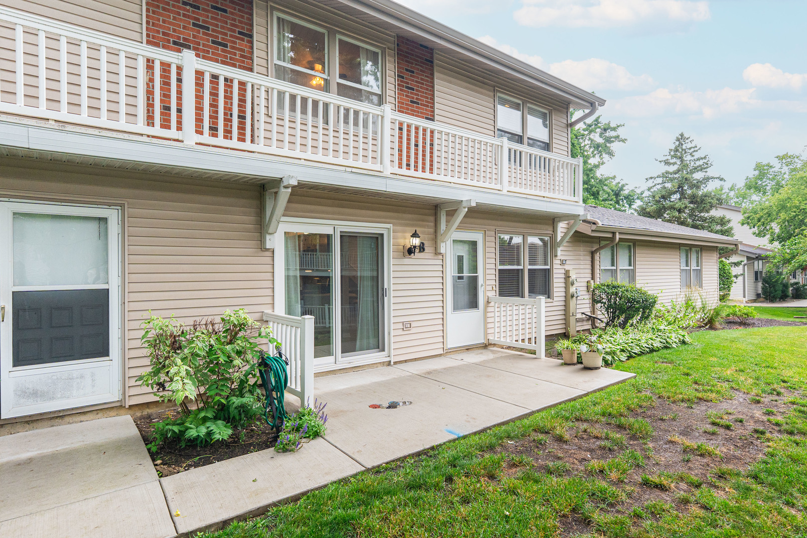 327 Georgetown Court, Unit B Bloomingdale, IL 60108 - Photo 2 of 25 front view of a house with a yard