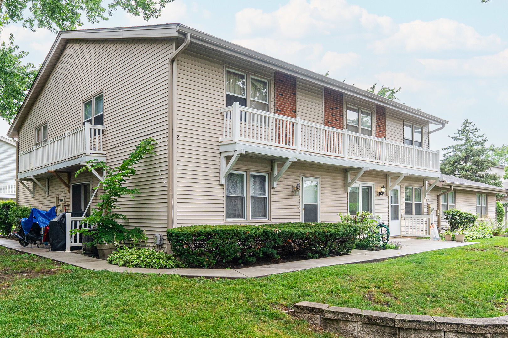 327 Georgetown Court, Unit B Bloomingdale, IL 60108 - Photo 23 of 25 a front view of a house with a yard