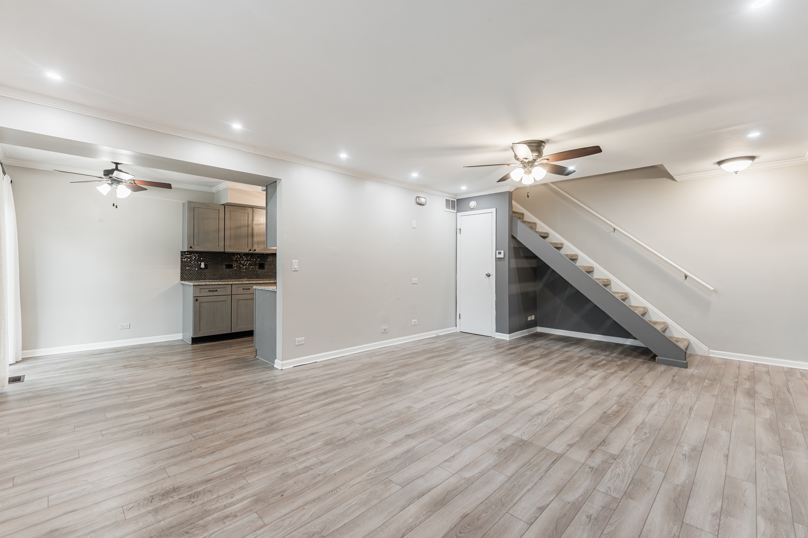 327 Georgetown Court, Unit B Bloomingdale, IL 60108 - Photo 5 of 25 a view of a kitchen with a sink and a stove top oven