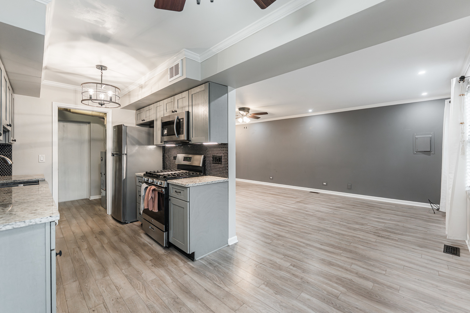 327 Georgetown Court, Unit B Bloomingdale, IL 60108 - Photo 6 of 25 a kitchen with stainless steel appliances granite countertop a refrigerator and a stove