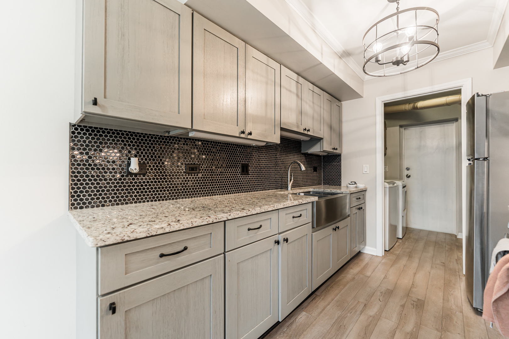 327 Georgetown Court, Unit B Bloomingdale, IL 60108 - Photo 8 of 25 a kitchen with stainless steel appliances granite countertop a sink a stove and cabinets