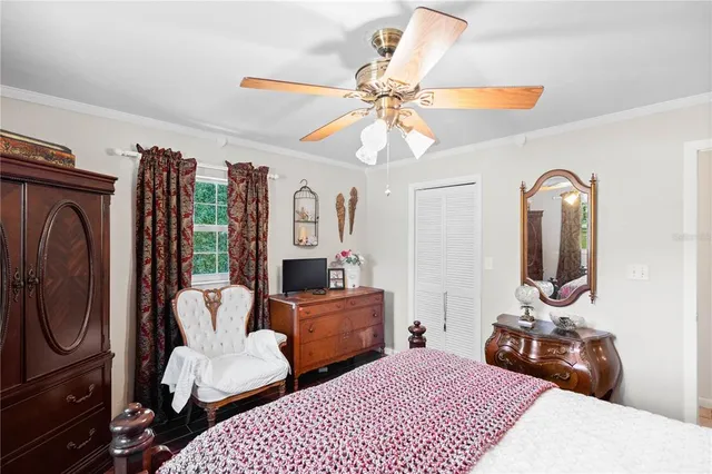 a bedroom with furniture and a chandelier