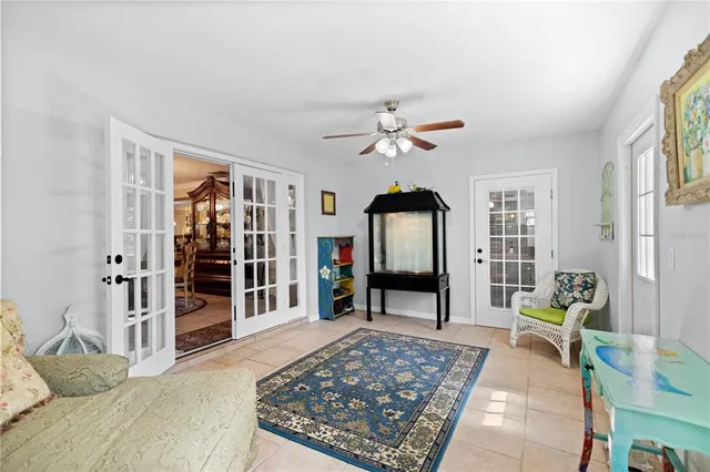 a living room with furniture a dining table and a piano table