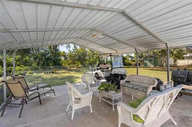 a view of swimming pool with outdoor seating