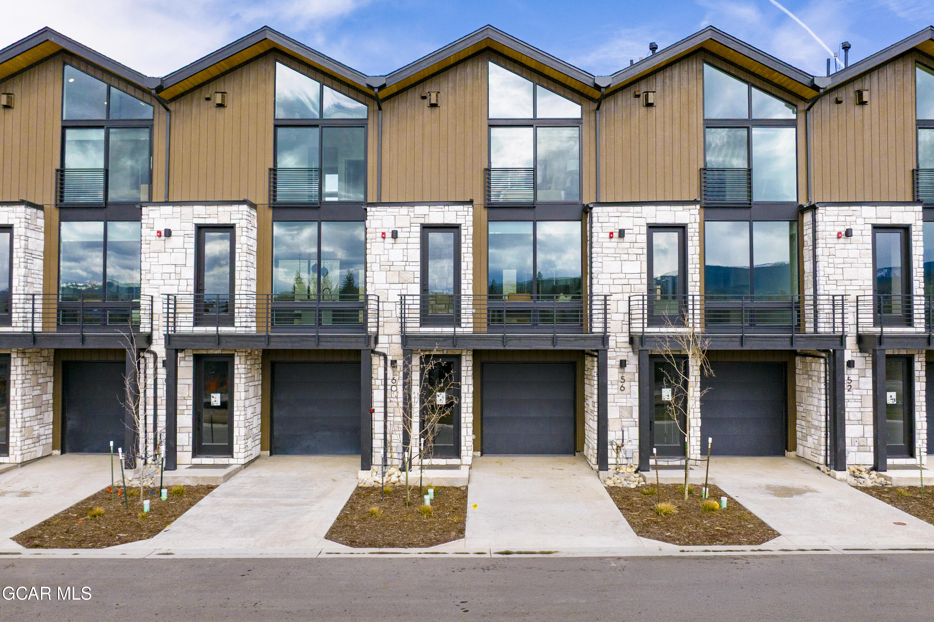 a view of a brick building with many windows