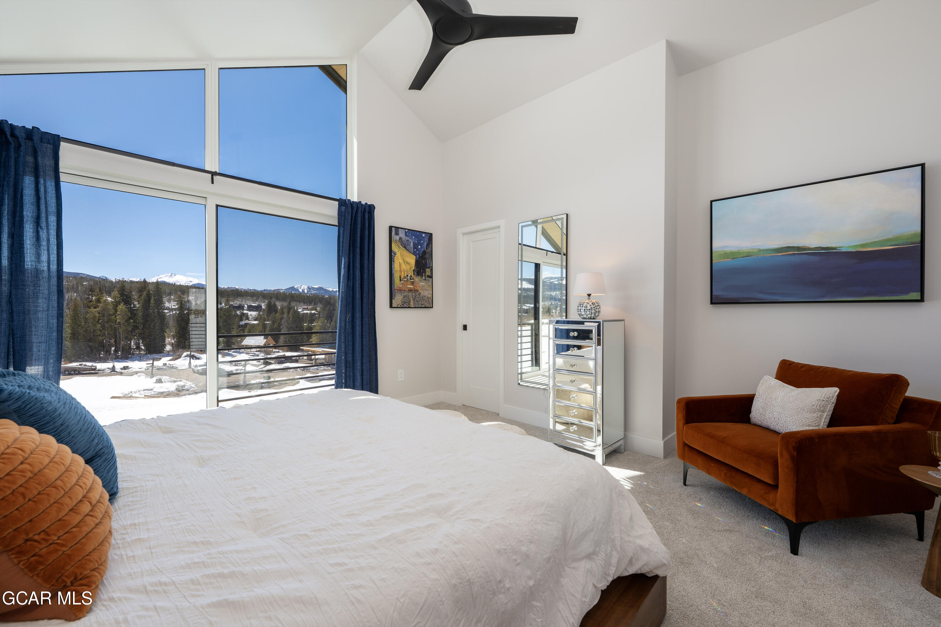 60 Wheeler Road Winter Park, CO 80482 - Photo 25 of 53 a spacious bedroom with a bed and glass window