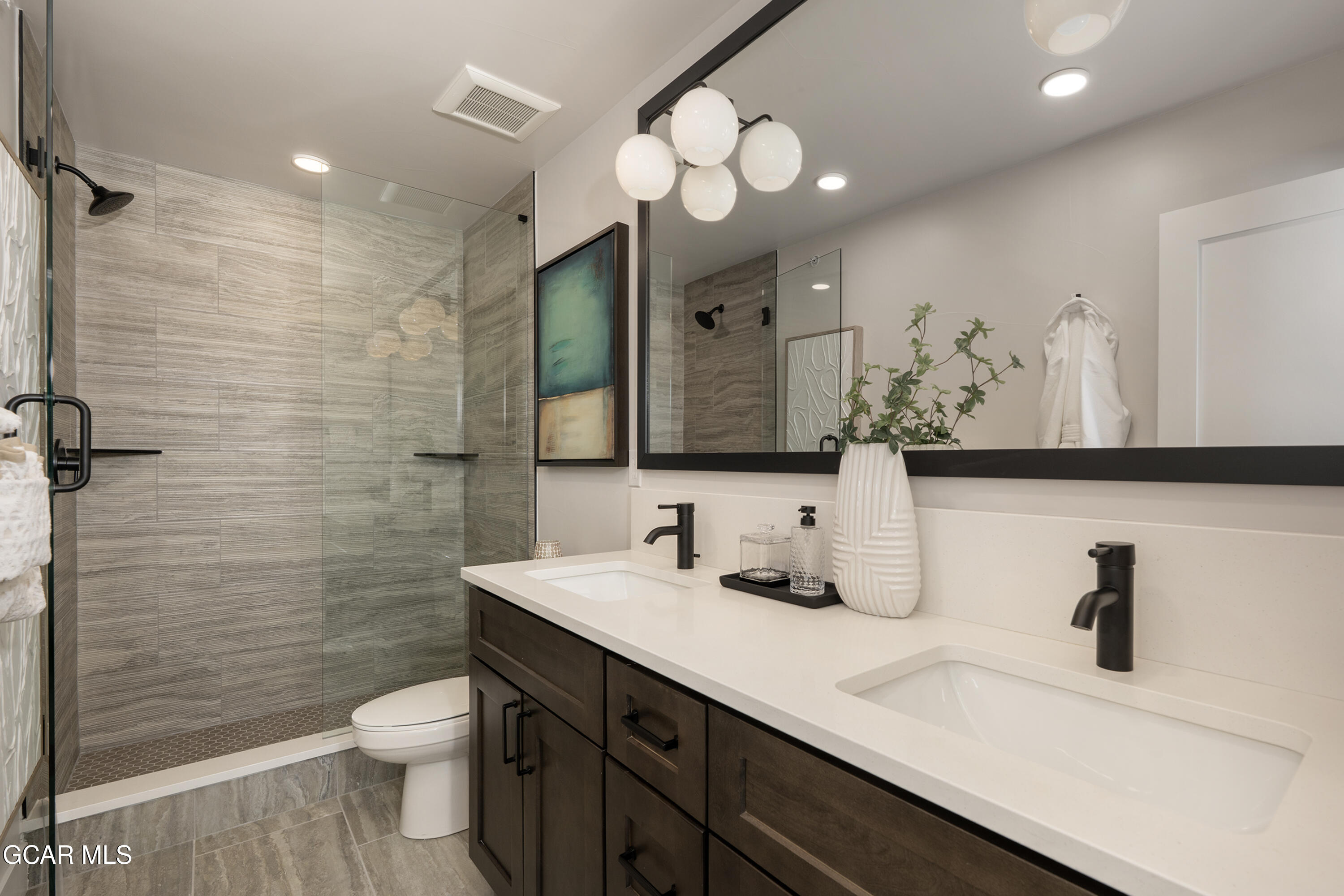 60 Wheeler Road Winter Park, CO 80482 - Photo 27 of 53 a bathroom with a sink a toilet and a mirror