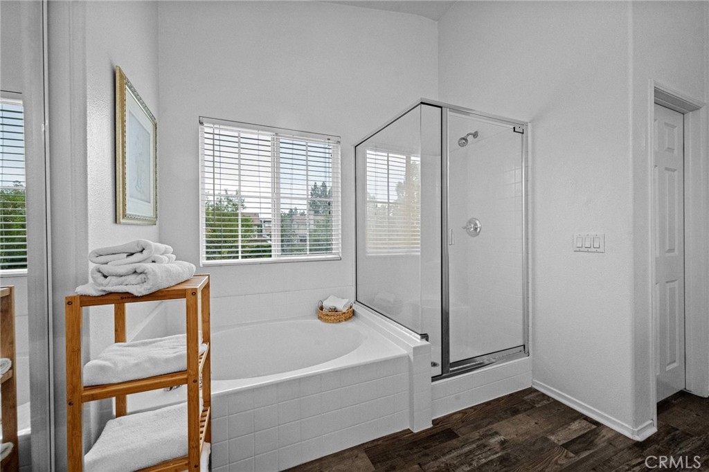 7220 Cumberland Place Rancho Cucamonga, CA 91739 - Photo 35 of 41 Soaking tub and separate glass-enclosed shower complete the spa-like primary bath with dual walk-in closets and private water closet.