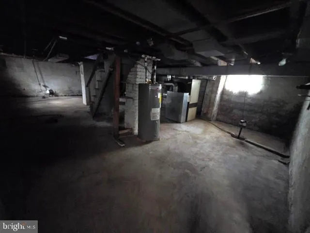 a view of water heater room with gym equipment