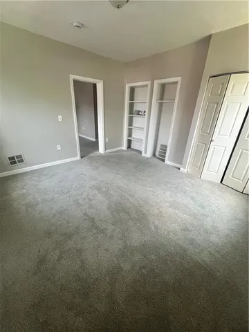 a view of empty room with front door