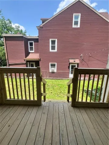 a front view of a house with large window and wooden floor