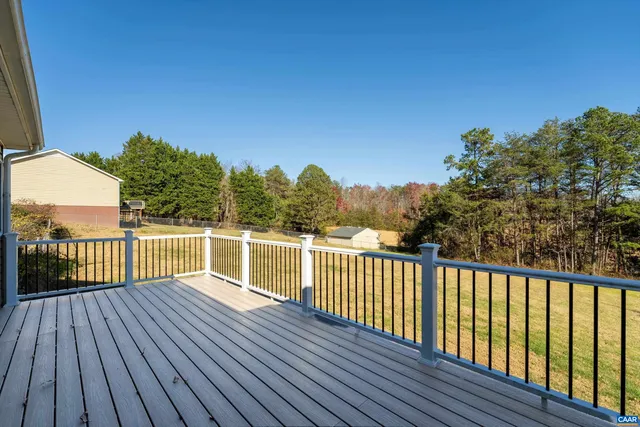 a view of a balcony with wooden floor