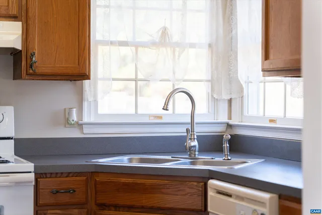a kitchen with a sink and a window