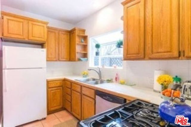 a kitchen with a sink cabinets and window