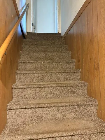 a view of a brick house with a yard