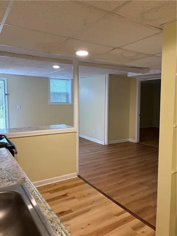 a kitchen with a stove a refrigerator and cabinets