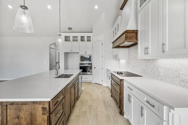 a view of an empty room with windows