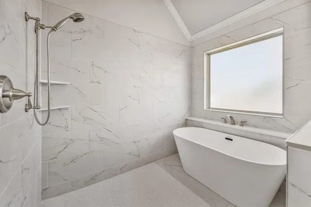 a spacious bathroom with a granite countertop sink mirror and cabinets