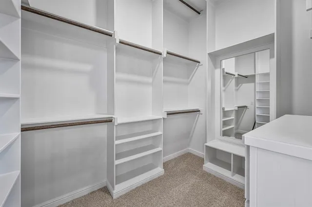 a view of an empty walk in closet