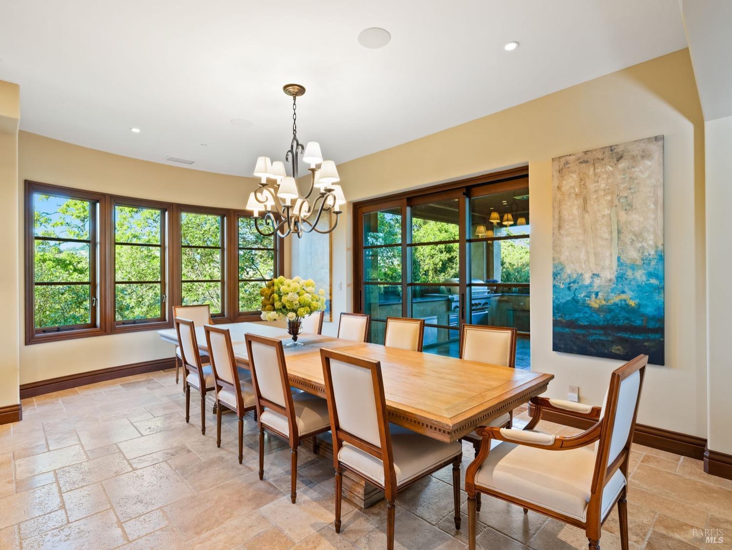 6444 Cottage Ridge Road Santa Rosa, CA 95403 - Photo 12 of 95 a dining room with furniture a chandelier and garden view