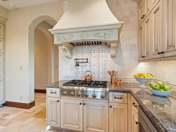 a kitchen with a refrigerator and a sink
