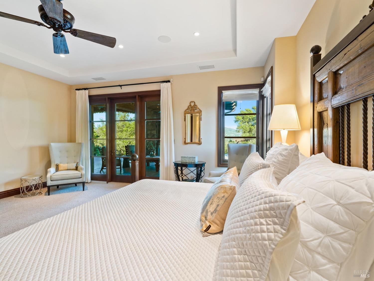 6444 Cottage Ridge Road Santa Rosa, CA 95403 - Photo 24 of 95 a large bedroom with a bed large mirror and a large window