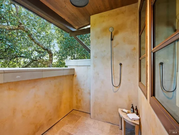 a white bath tub sitting in a bathroom next to a window