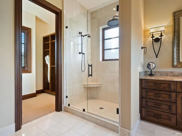 a bathroom with a shower a toilet and a window