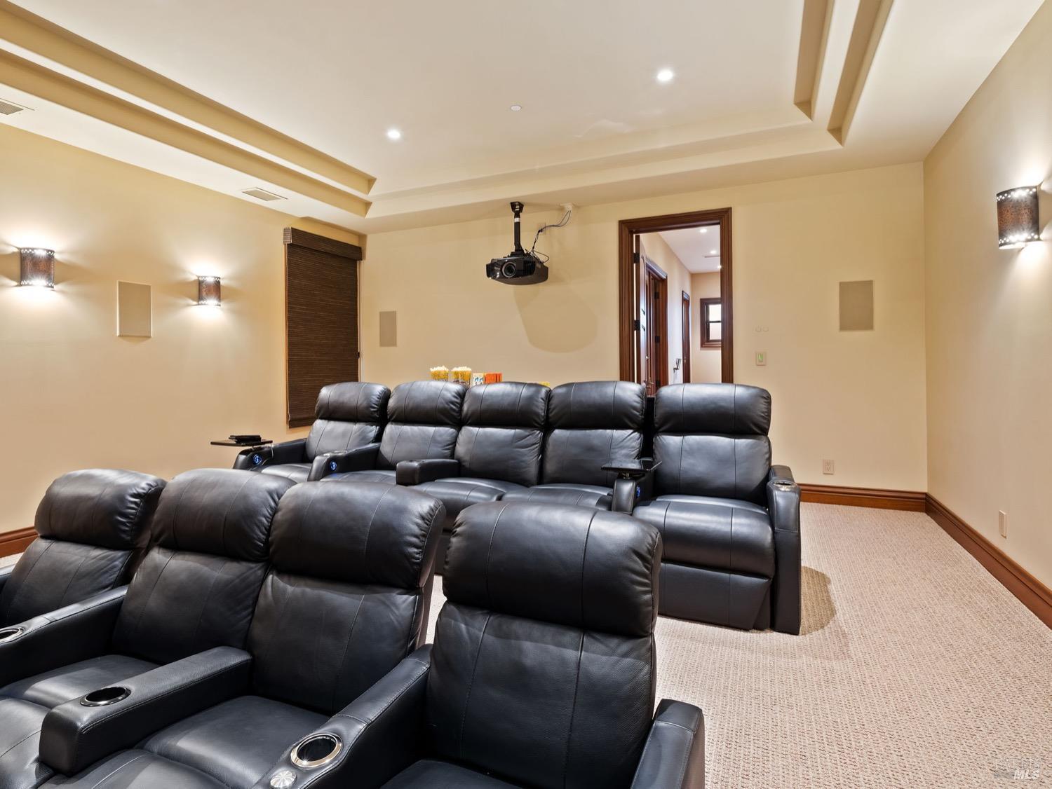 6444 Cottage Ridge Road Santa Rosa, CA 95403 - Photo 49 of 95 a projector room with a couch and a projector screen