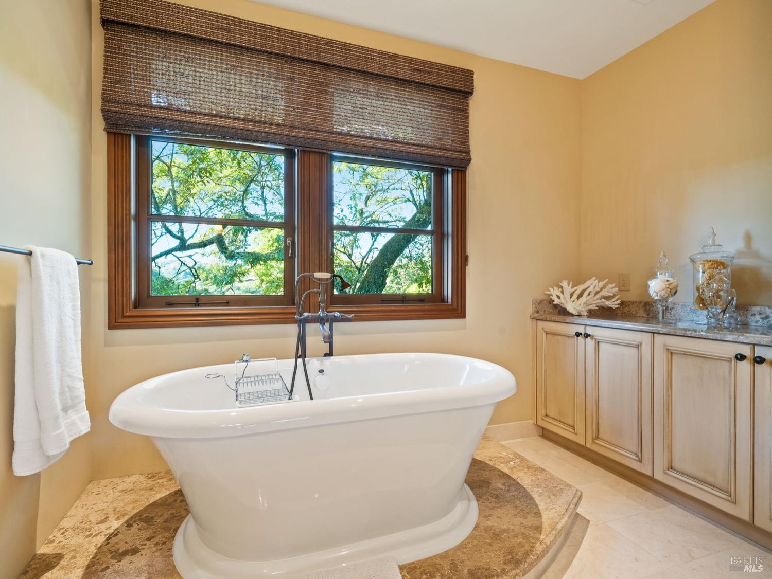 6444 Cottage Ridge Road Santa Rosa, CA 95403 - Photo 56 of 95 a white bath tub sitting in a bathroom next to a window