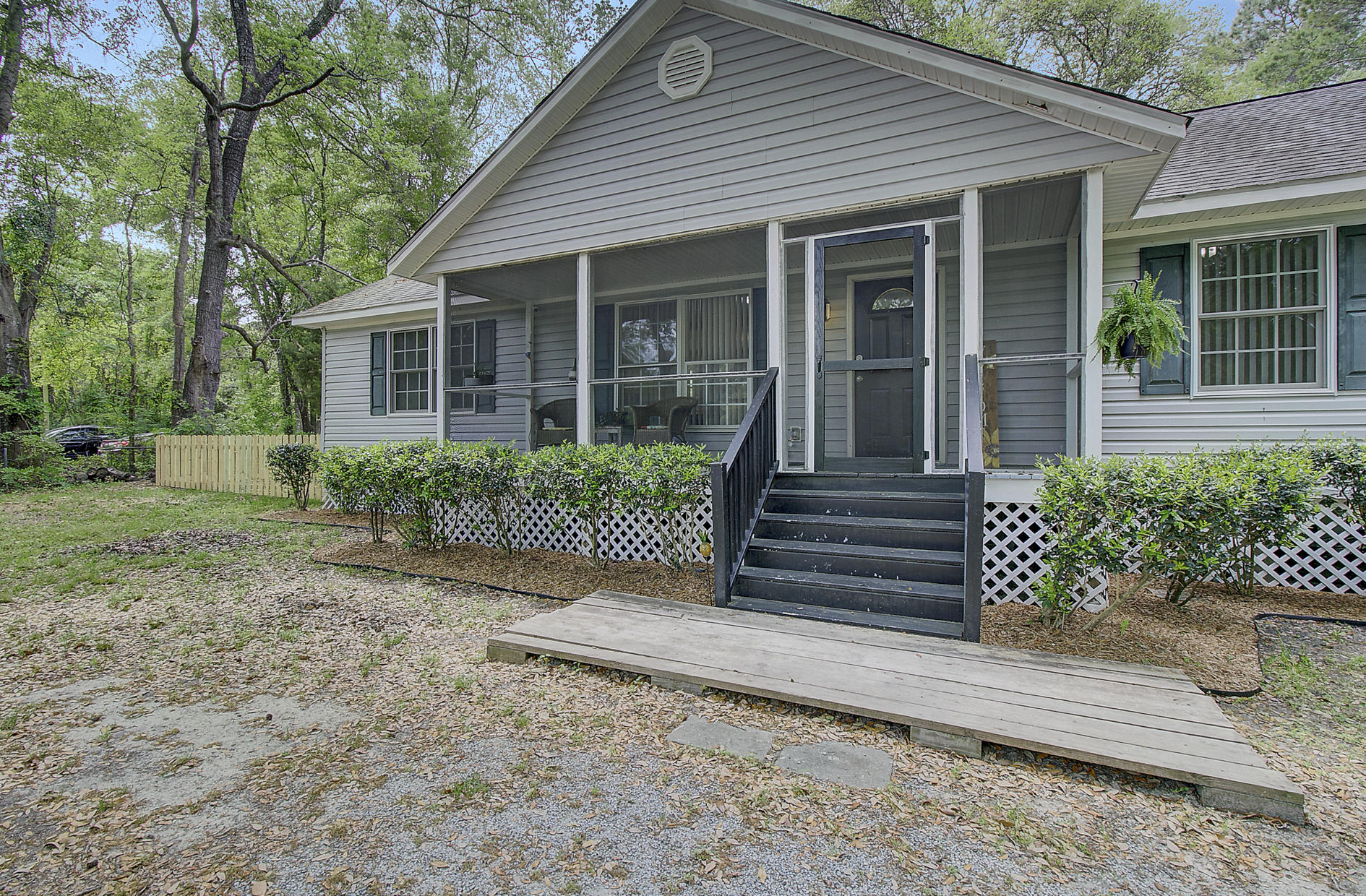 548 Main Road Johns Island, SC 29455 - Photo 5 of 32 548 Main Rd - Screened-In Front Porch
