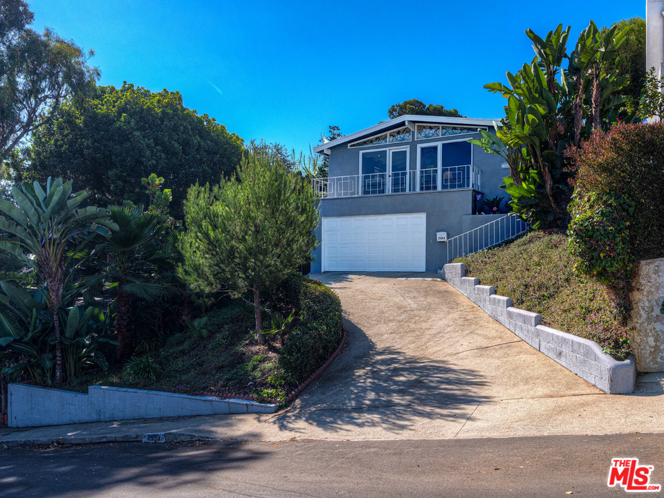 7553 Trask Avenue Playa del Rey, CA 90293 - Photo 1 of 24 a front view of a house with a yard