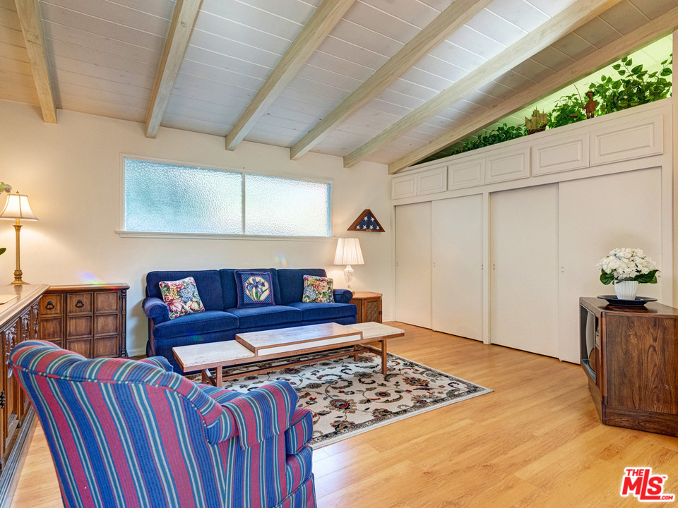 7553 Trask Avenue Playa del Rey, CA 90293 - Photo 14 of 24 a living room with lots of furniture and a rug