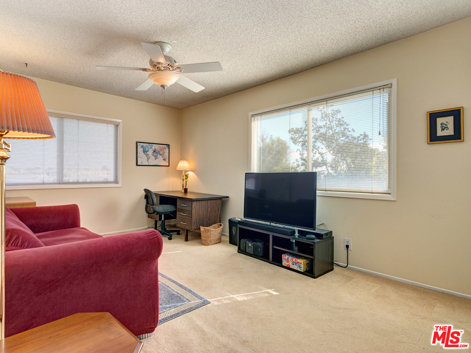 7553 Trask Avenue Playa del Rey, CA 90293 - Photo 18 of 24 a living room with furniture and a flat screen tv