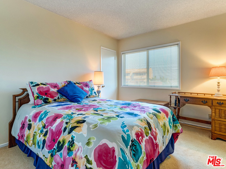 7553 Trask Avenue Playa del Rey, CA 90293 - Photo 21 of 24 a bedroom with a bed and window