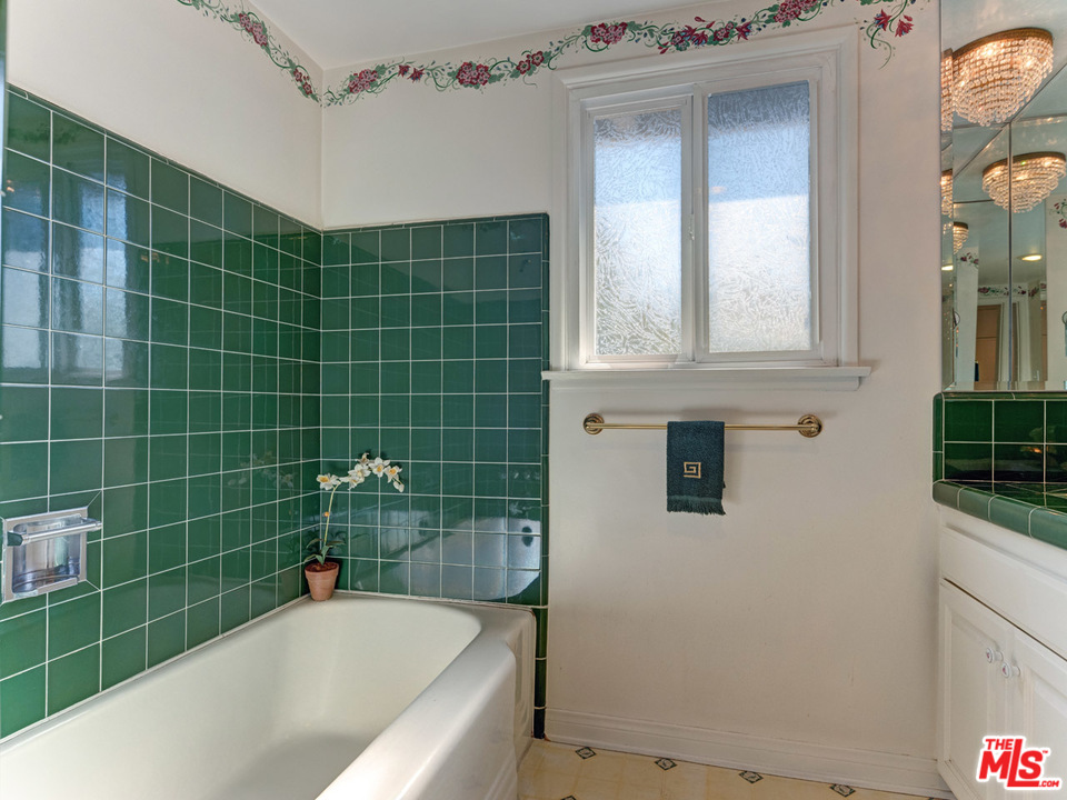 7553 Trask Avenue Playa del Rey, CA 90293 - Photo 22 of 24 a bathroom with a bathtub and shower