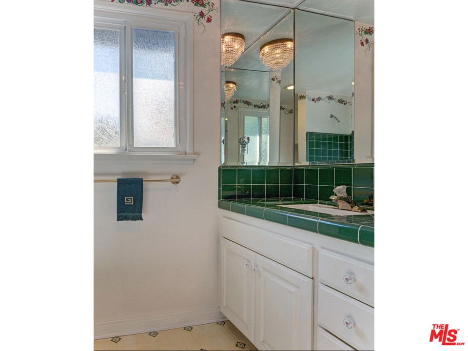 7553 Trask Avenue Playa del Rey, CA 90293 - Photo 23 of 24 a bathroom with a sink and a mirror