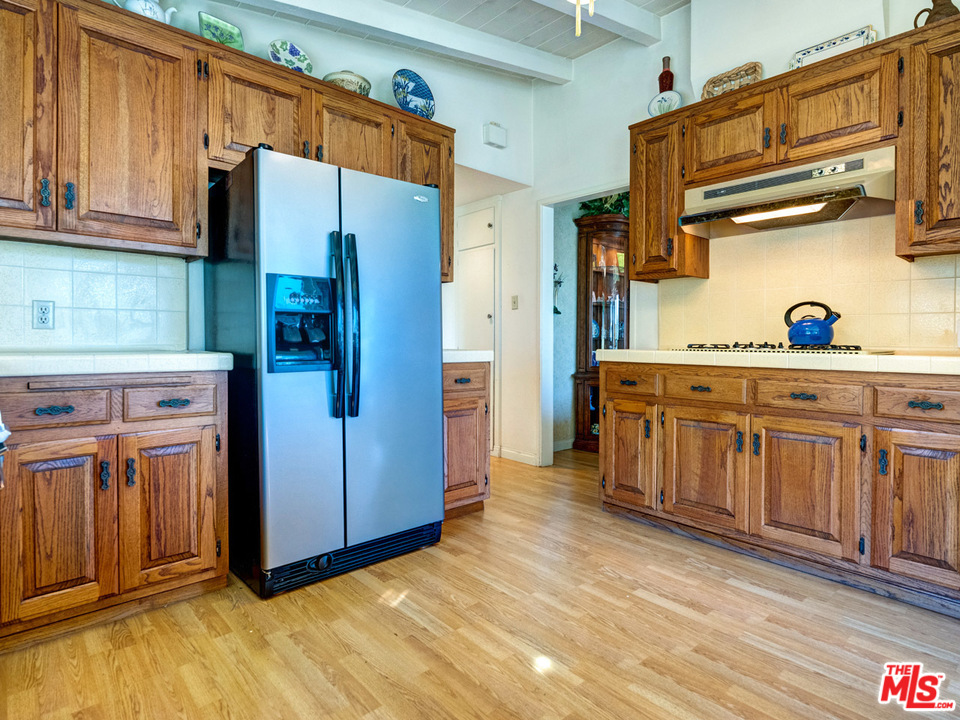 7553 Trask Avenue Playa del Rey, CA 90293 - Photo 8 of 24 a kitchen with stainless steel appliances a refrigerator and cabinets