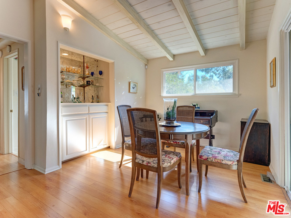 7553 Trask Avenue Playa del Rey, CA 90293 - Photo 9 of 24 a view of a dining room with furniture window and wooden floor