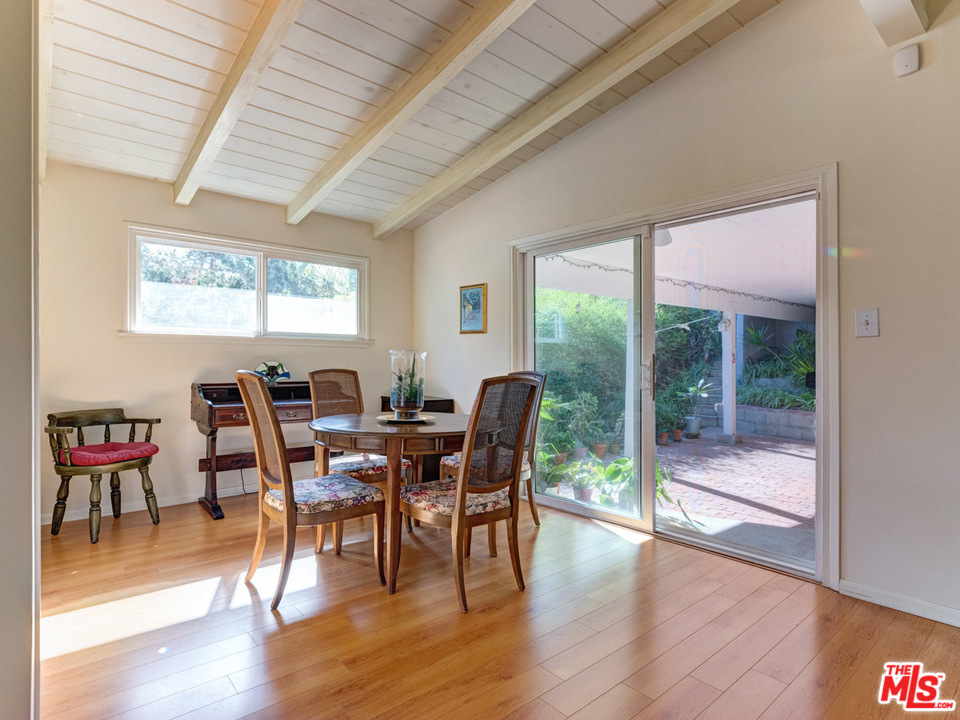 7553 Trask Avenue Playa del Rey, CA 90293 - Photo 10 of 24 a view of a dining room with furniture window and wooden floor