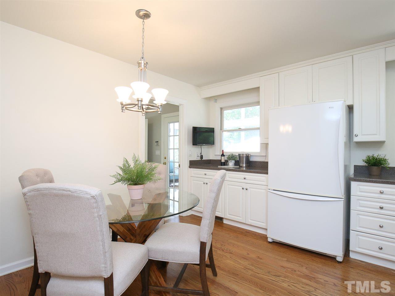 1829 Mt Vernon Church Road Raleigh, NC 27614 - Photo 11 of 30 a kitchen with stainless steel appliances granite countertop a refrigerator and a dining table