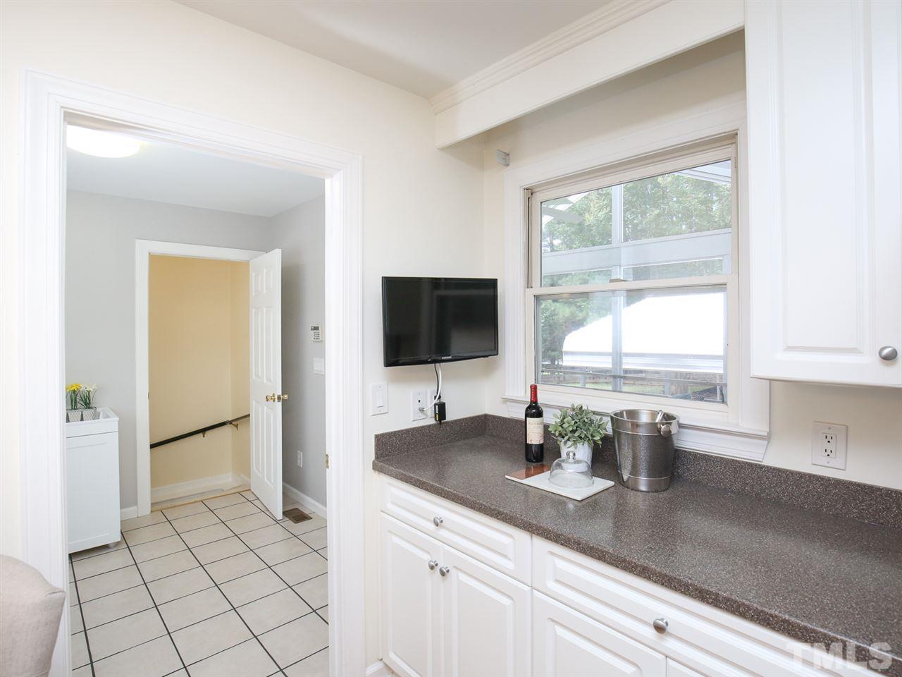 1829 Mt Vernon Church Road Raleigh, NC 27614 - Photo 13 of 30 a kitchen with stainless steel appliances a sink a stove and a refrigerator