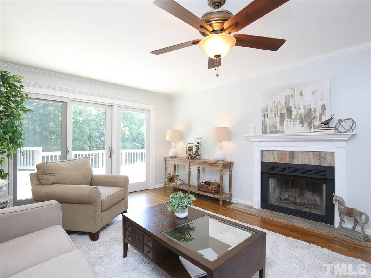1829 Mt Vernon Church Road Raleigh, NC 27614 - Photo 20 of 30 a living room with furniture a fireplace and a large window