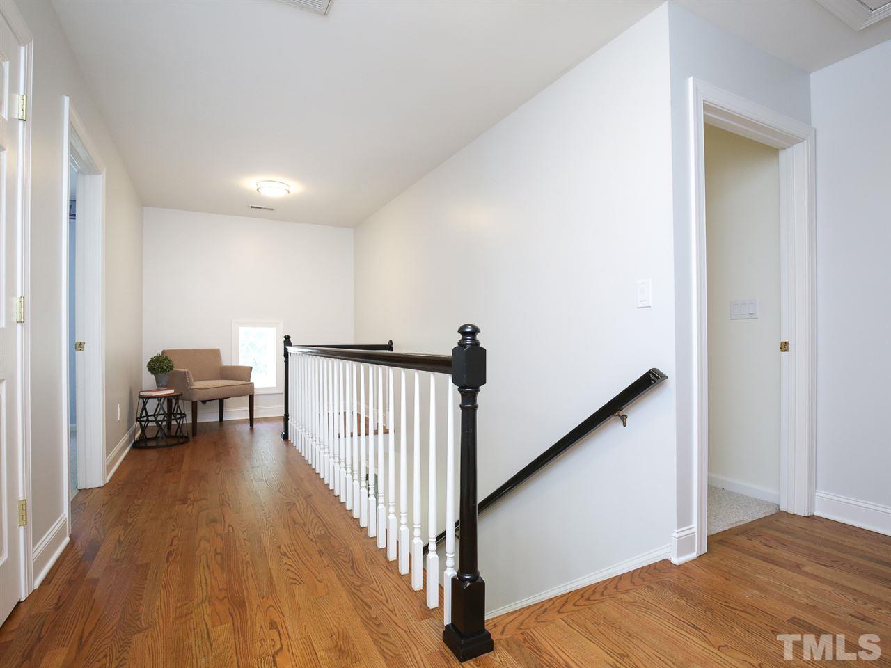 1829 Mt Vernon Church Road Raleigh, NC 27614 - Photo 21 of 30 a view of a hallway with wooden floor and a bathroom
