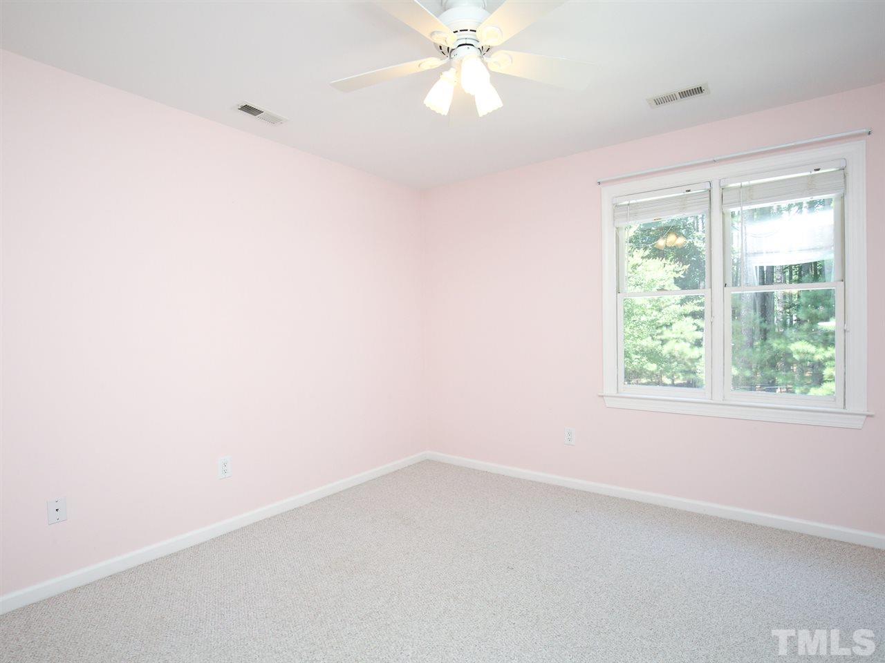 1829 Mt Vernon Church Road Raleigh, NC 27614 - Photo 22 of 30 an empty room with a window and a fan