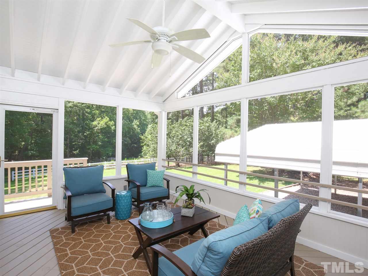1829 Mt Vernon Church Road Raleigh, NC 27614 - Photo 24 of 30 a living room with furniture and floor to ceiling windows