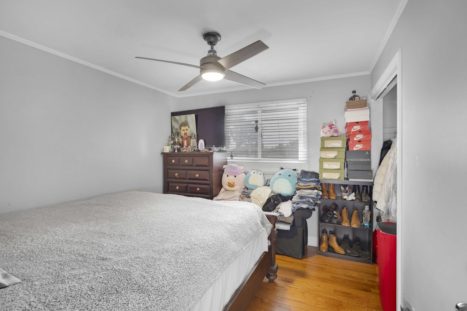 1943 182nd Street Lansing, IL 60438 - Photo 12 of 17 a bed room with a bed window and a ceiling fan
