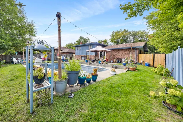 a view of a house with sitting area and garden