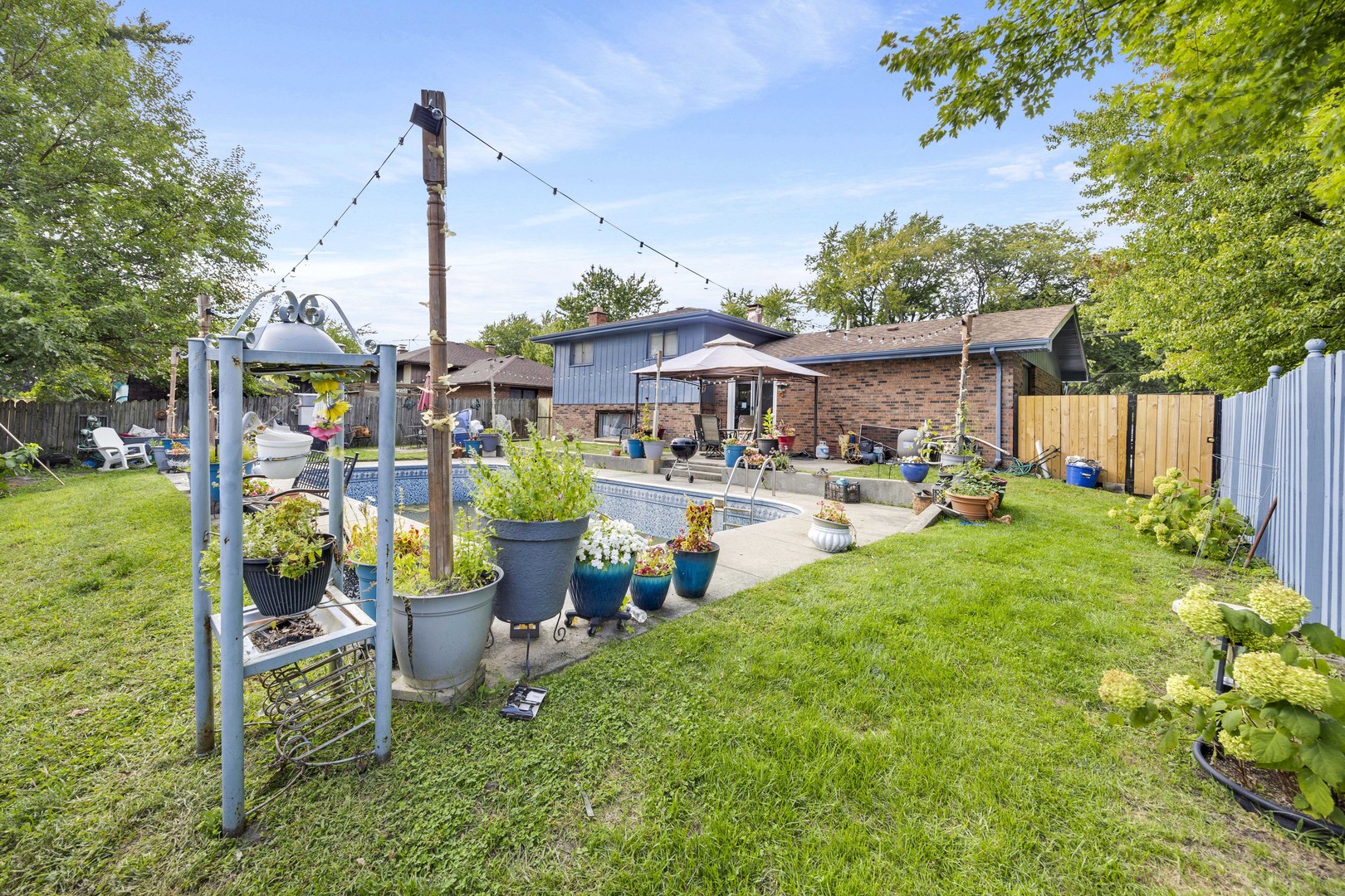 1943 182nd Street Lansing, IL 60438 - Photo 16 of 17 a view of a house with sitting area and garden