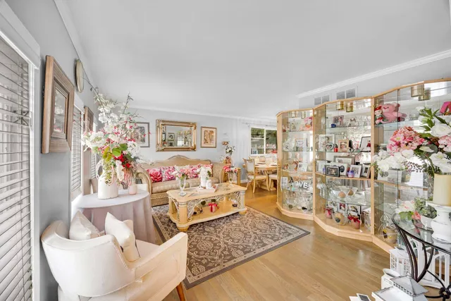 a living room with lots of furniture and wooden floor